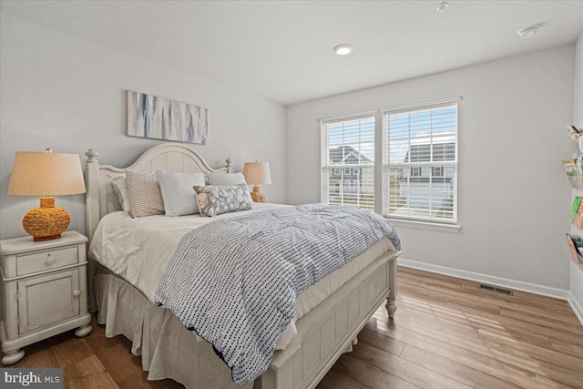 bedroom featuring light wood-type flooring