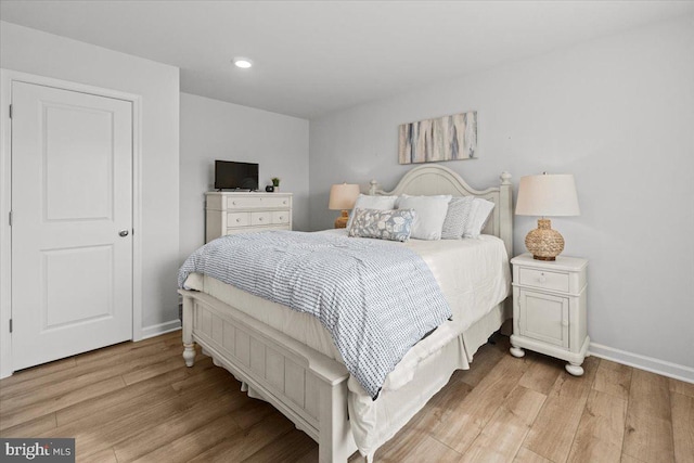 bedroom with light hardwood / wood-style flooring