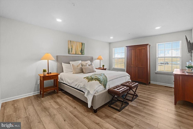 bedroom with light hardwood / wood-style flooring