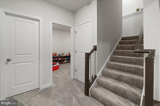 stairway with carpet floors