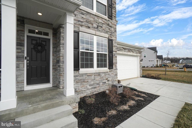 doorway to property featuring a garage