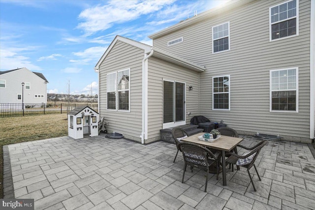 view of patio featuring an outbuilding