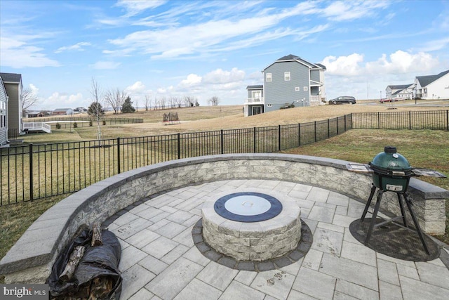 view of patio / terrace featuring a fire pit