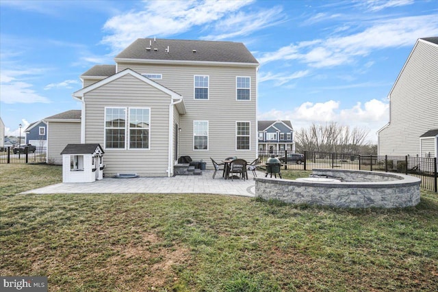 back of property featuring a patio and a yard