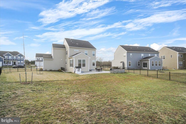 back of property featuring a yard and a patio