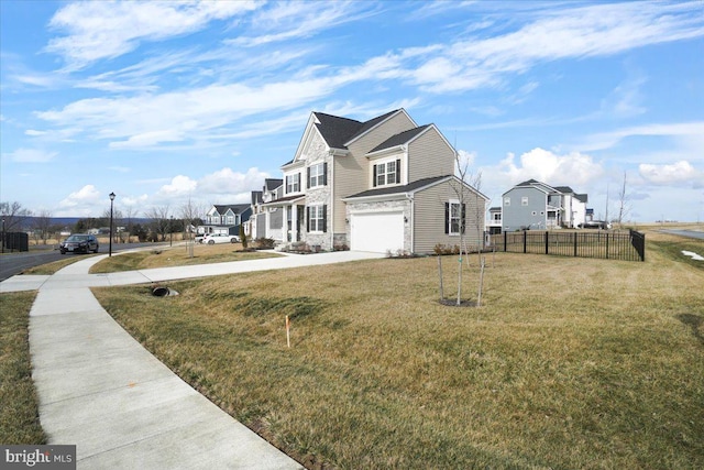 view of front of home with a garage and a front yard