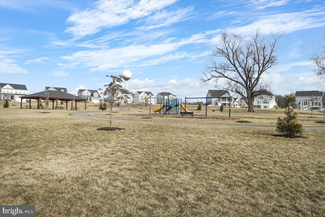 view of play area with a gazebo and a lawn