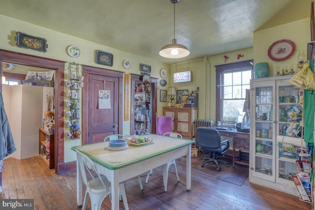 dining space featuring hardwood / wood-style floors
