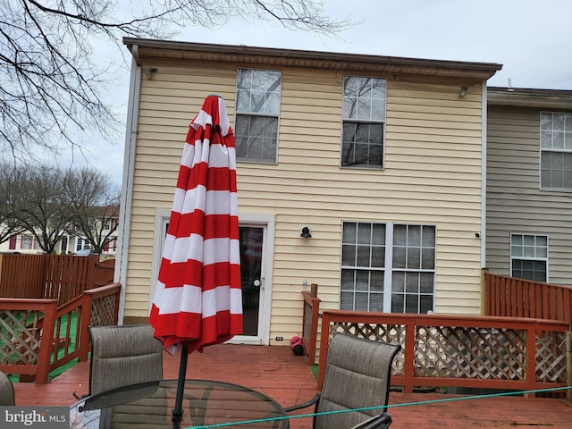 rear view of house with a wooden deck