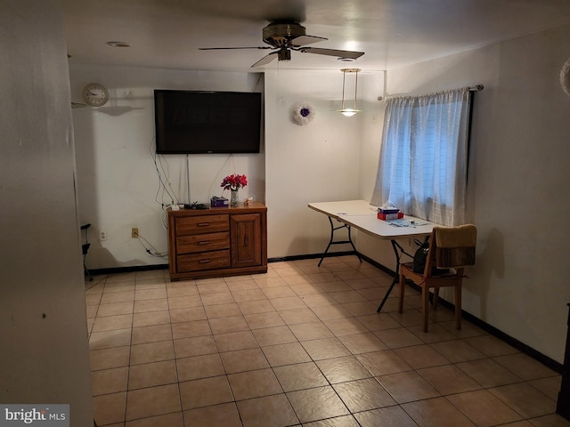 interior space with ceiling fan and light tile patterned floors