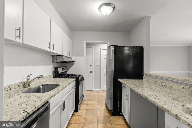 574 Wilson Bridge Dr Unit D-2, Oxon Hill, MD 20745 - kitchen featuring white cabinetry, appliances with stainless steel finishes, light stone countertops, and sink