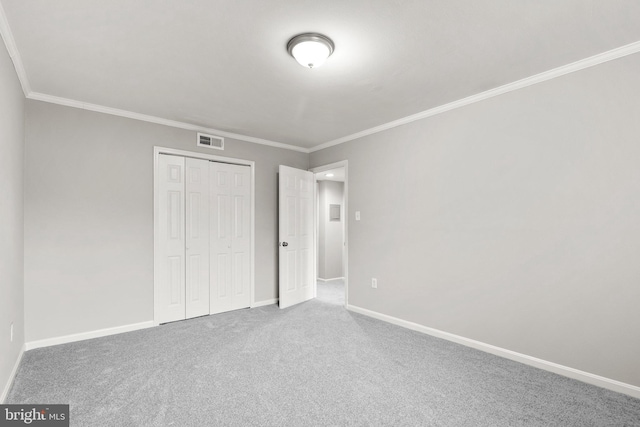 574 Wilson Bridge Dr Unit D-2, Oxon Hill, MD 20745 - unfurnished bedroom featuring crown molding, a closet, and carpet