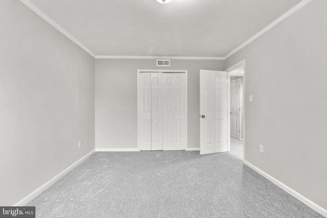 574 Wilson Bridge Dr Unit D-2, Oxon Hill, MD 20745 - unfurnished bedroom featuring ornamental molding, carpet, and a closet