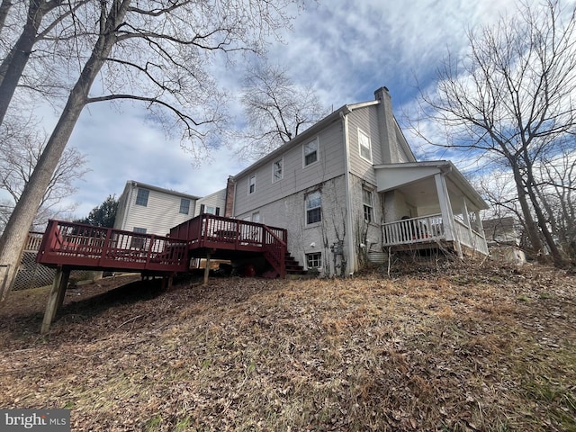 back of property featuring a wooden deck