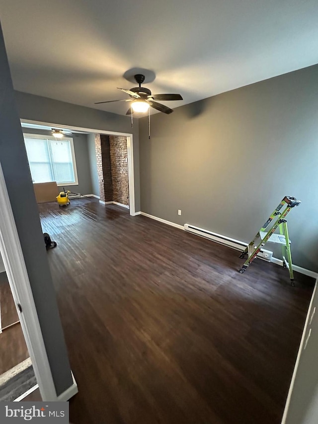 spare room featuring ceiling fan and dark hardwood / wood-style flooring