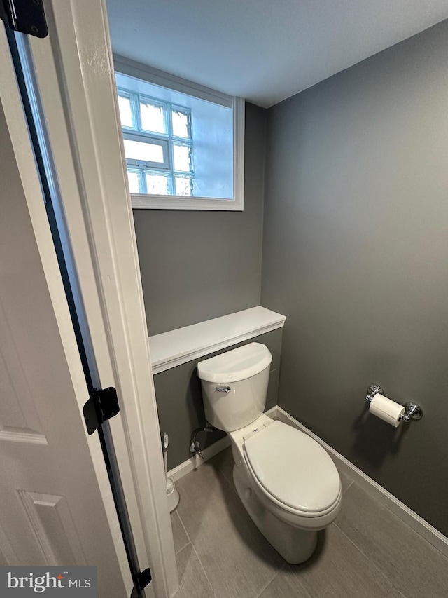 bathroom featuring tile patterned floors and toilet