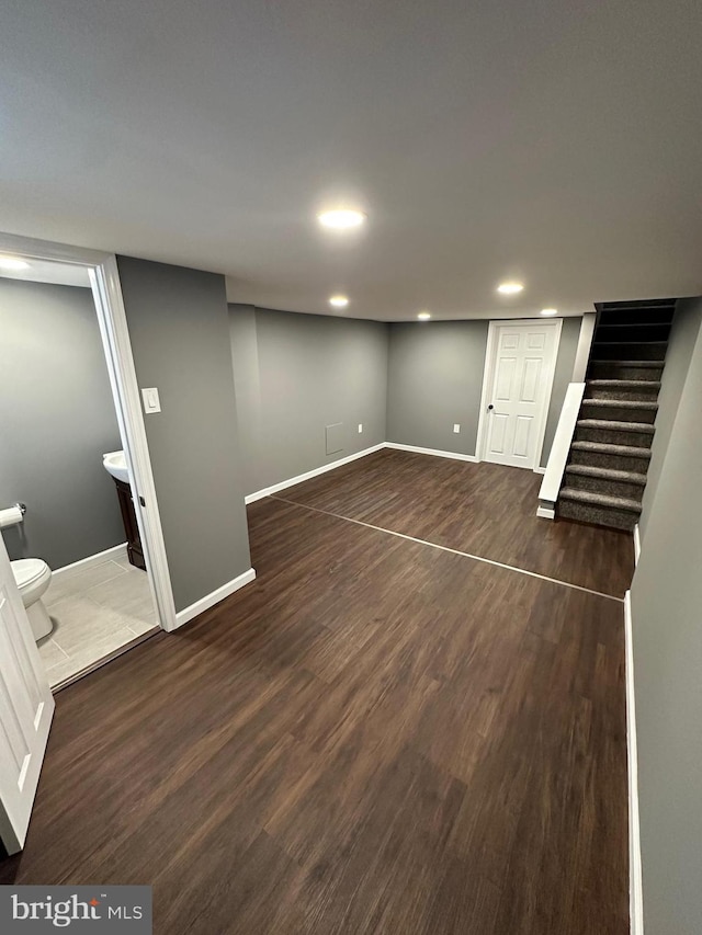 basement featuring dark hardwood / wood-style floors