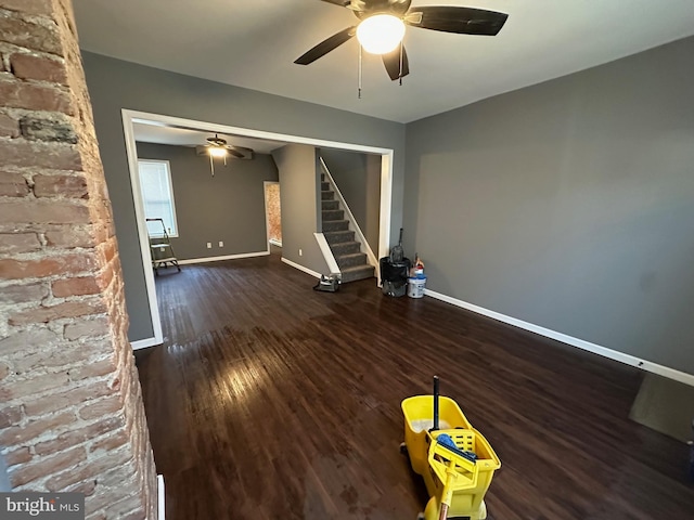 spare room with dark hardwood / wood-style floors and ceiling fan