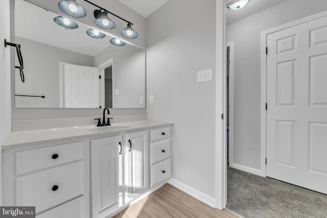 bathroom with vanity and hardwood / wood-style floors