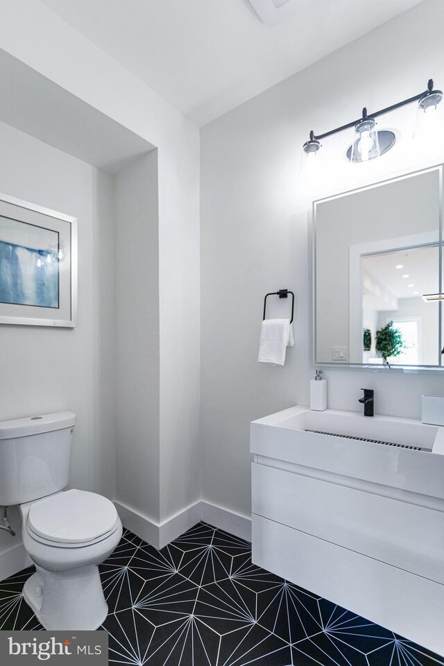 bathroom with vanity and toilet