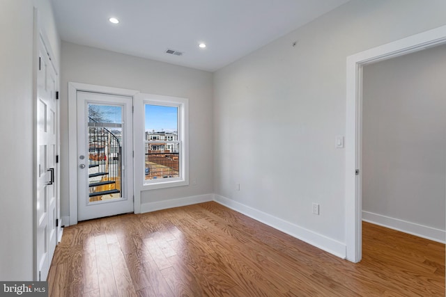empty room featuring hardwood / wood-style flooring