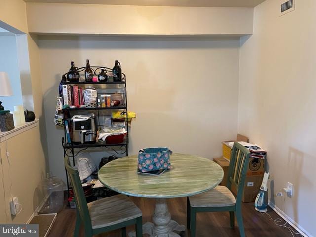 dining space featuring hardwood / wood-style flooring