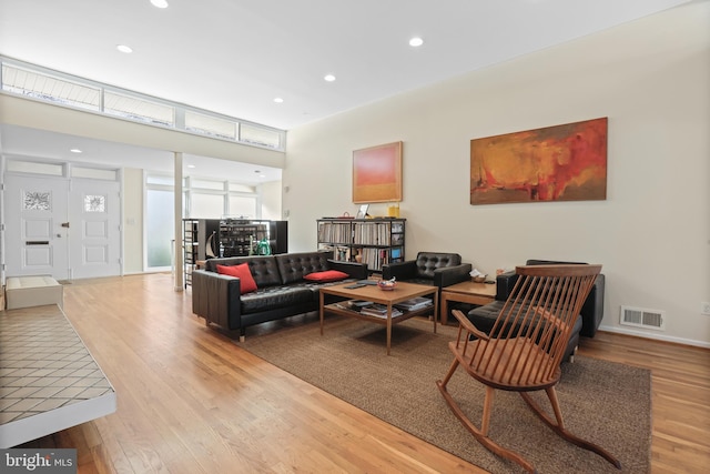 living area featuring visible vents, wood finished floors, and recessed lighting