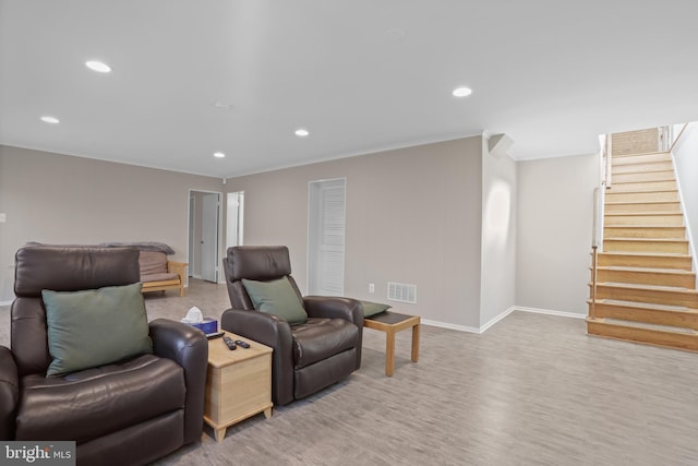 living area featuring stairs, baseboards, visible vents, and recessed lighting