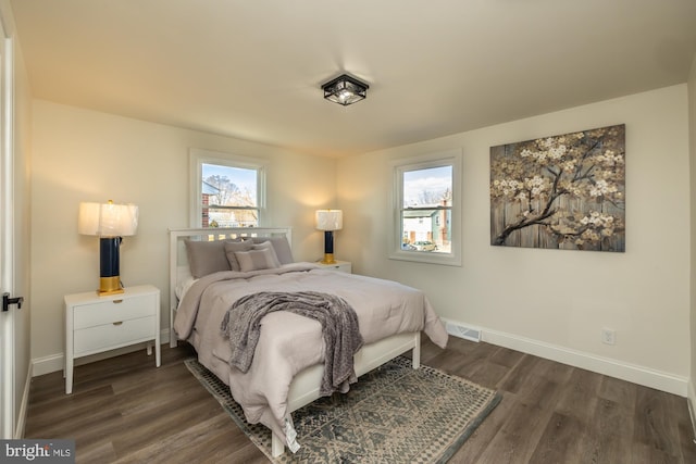 bedroom featuring dark hardwood / wood-style flooring