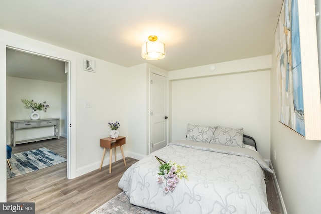 bedroom featuring wood-type flooring