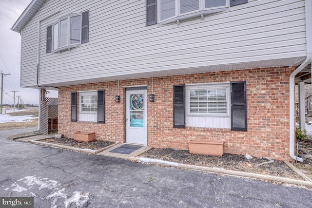 view of front of property featuring brick siding