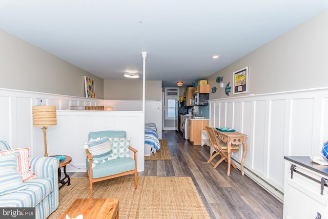 living area with dark hardwood / wood-style floors