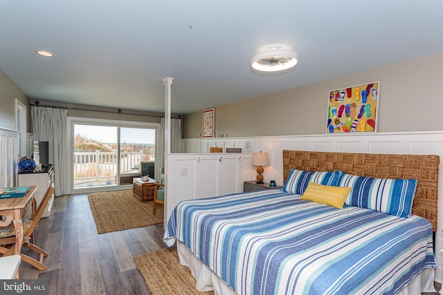 bedroom featuring dark hardwood / wood-style floors and access to outside