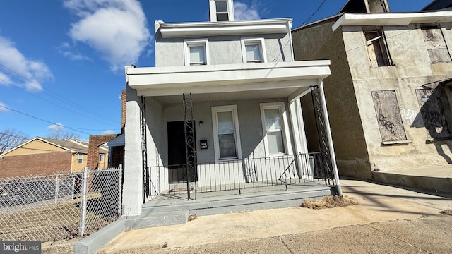 view of front of property featuring covered porch