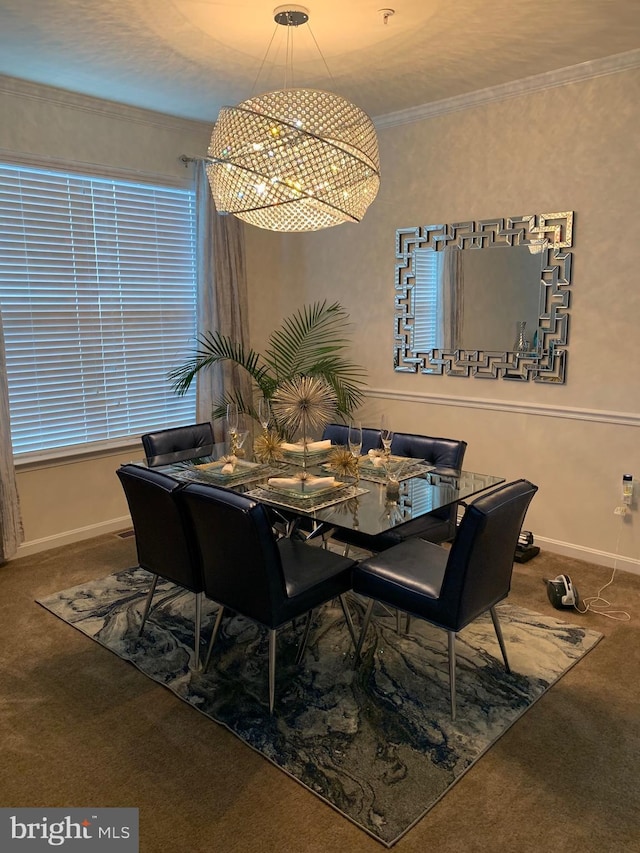 dining space featuring ornamental molding, carpet floors, and baseboards