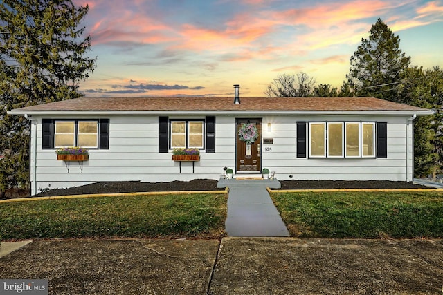 view of front of house with a lawn