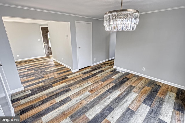 unfurnished dining area with crown molding, a notable chandelier, and dark hardwood / wood-style flooring