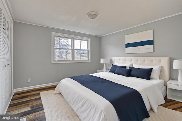 bedroom featuring crown molding and dark wood-type flooring