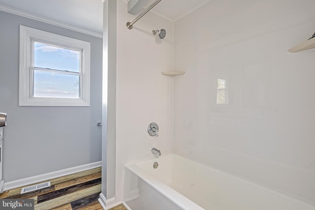 bathroom featuring shower / bath combination and ornamental molding