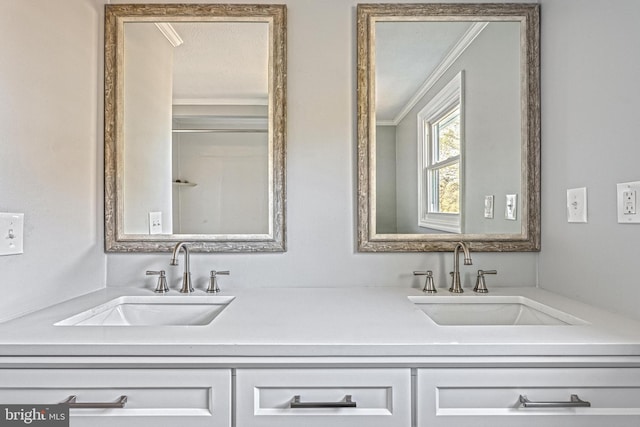 bathroom with crown molding and vanity