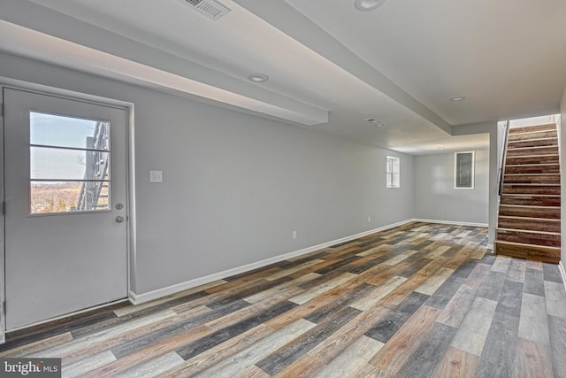 basement featuring dark wood-type flooring