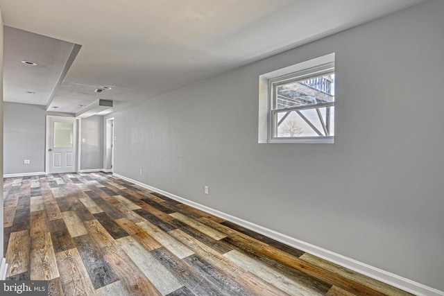 spare room with wood-type flooring