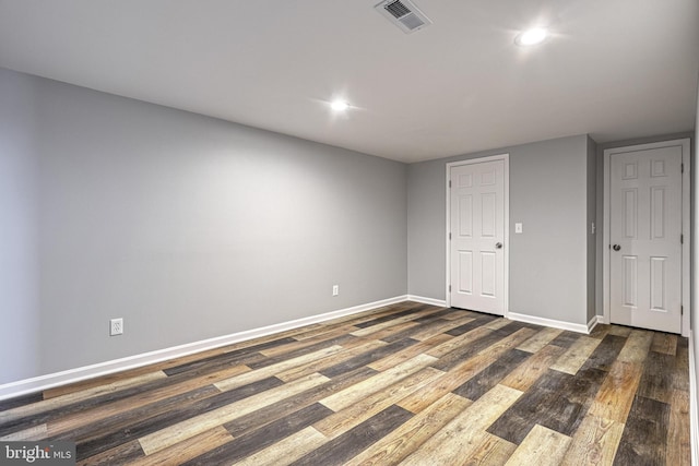 unfurnished bedroom with dark hardwood / wood-style floors