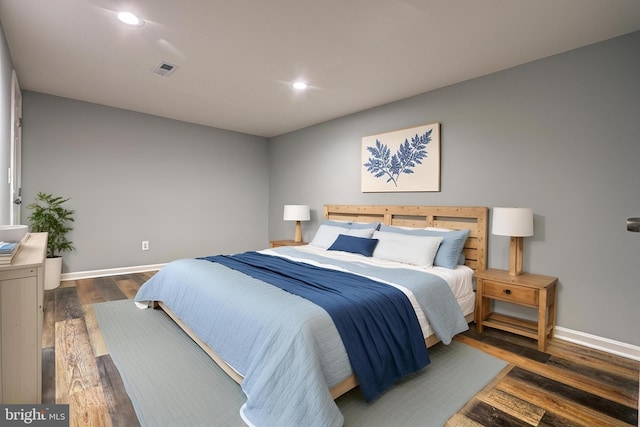 bedroom featuring dark hardwood / wood-style flooring