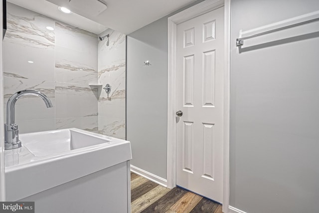 bathroom with vanity and hardwood / wood-style flooring