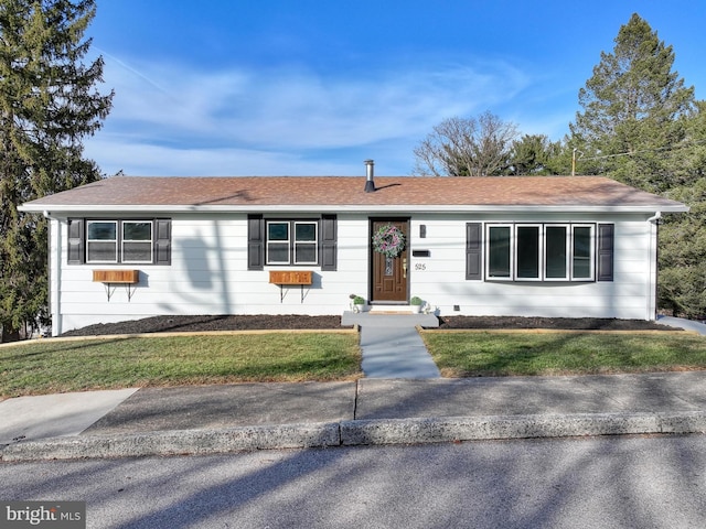 ranch-style house with a front lawn