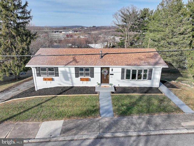 ranch-style home with a front yard