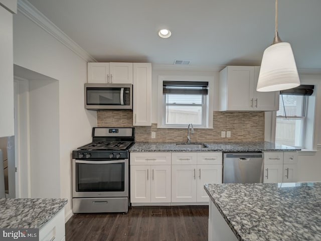 kitchen with white cabinetry, sink, and appliances with stainless steel finishes