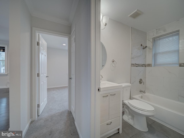 full bathroom with vanity, toilet, and tiled shower / bath combo