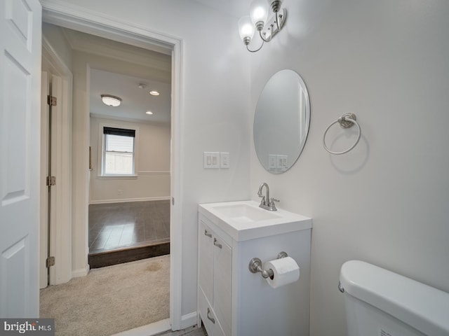 bathroom featuring vanity and toilet